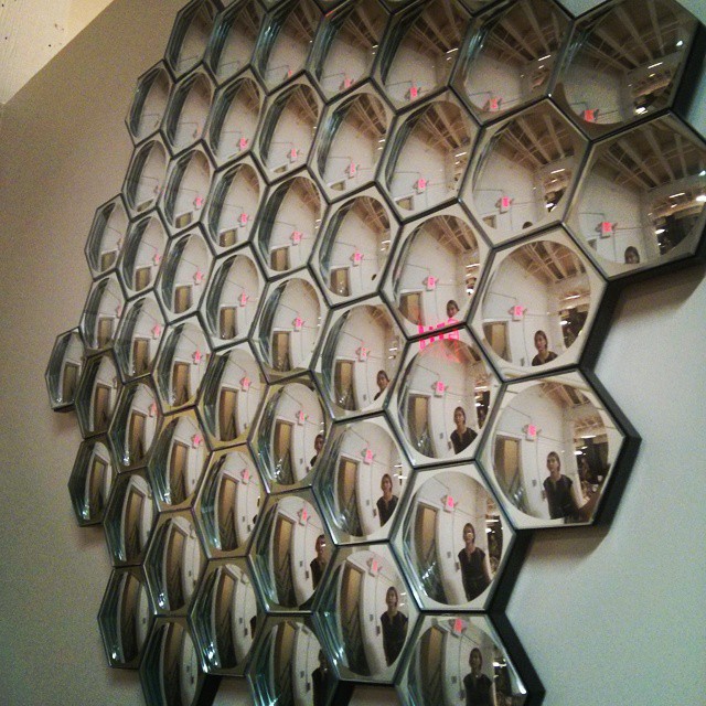the large mirror is arranged as an image with people