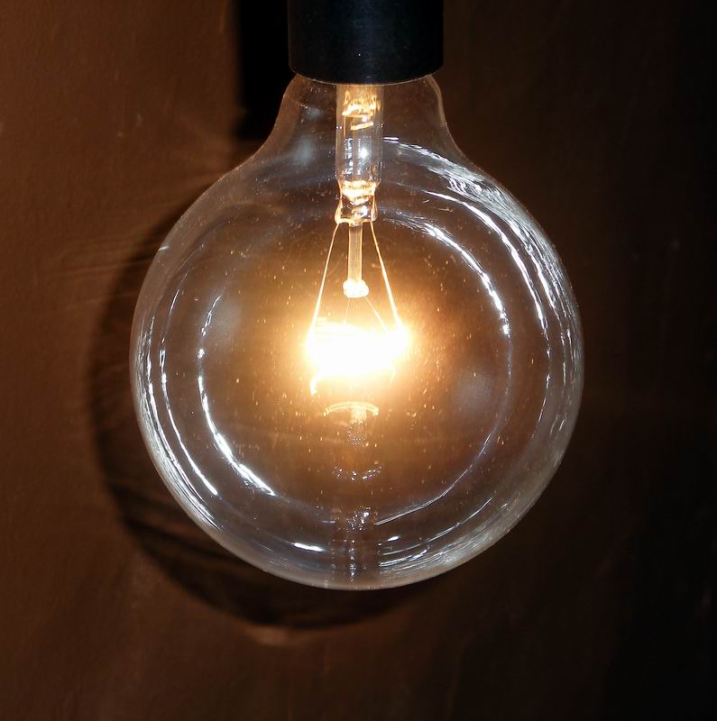 an antique looking light bulb with a clear bulb