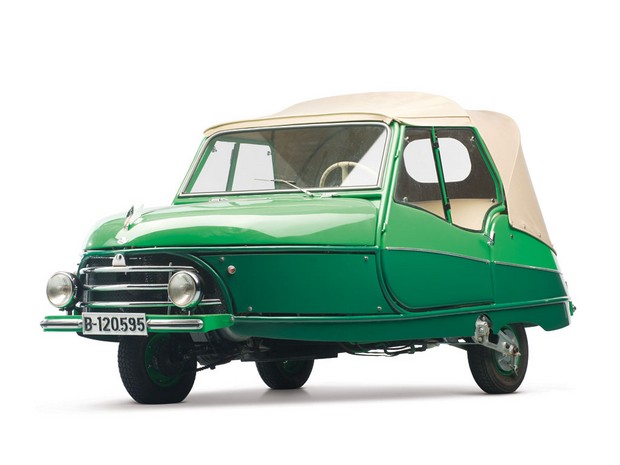 a small green car on a white background
