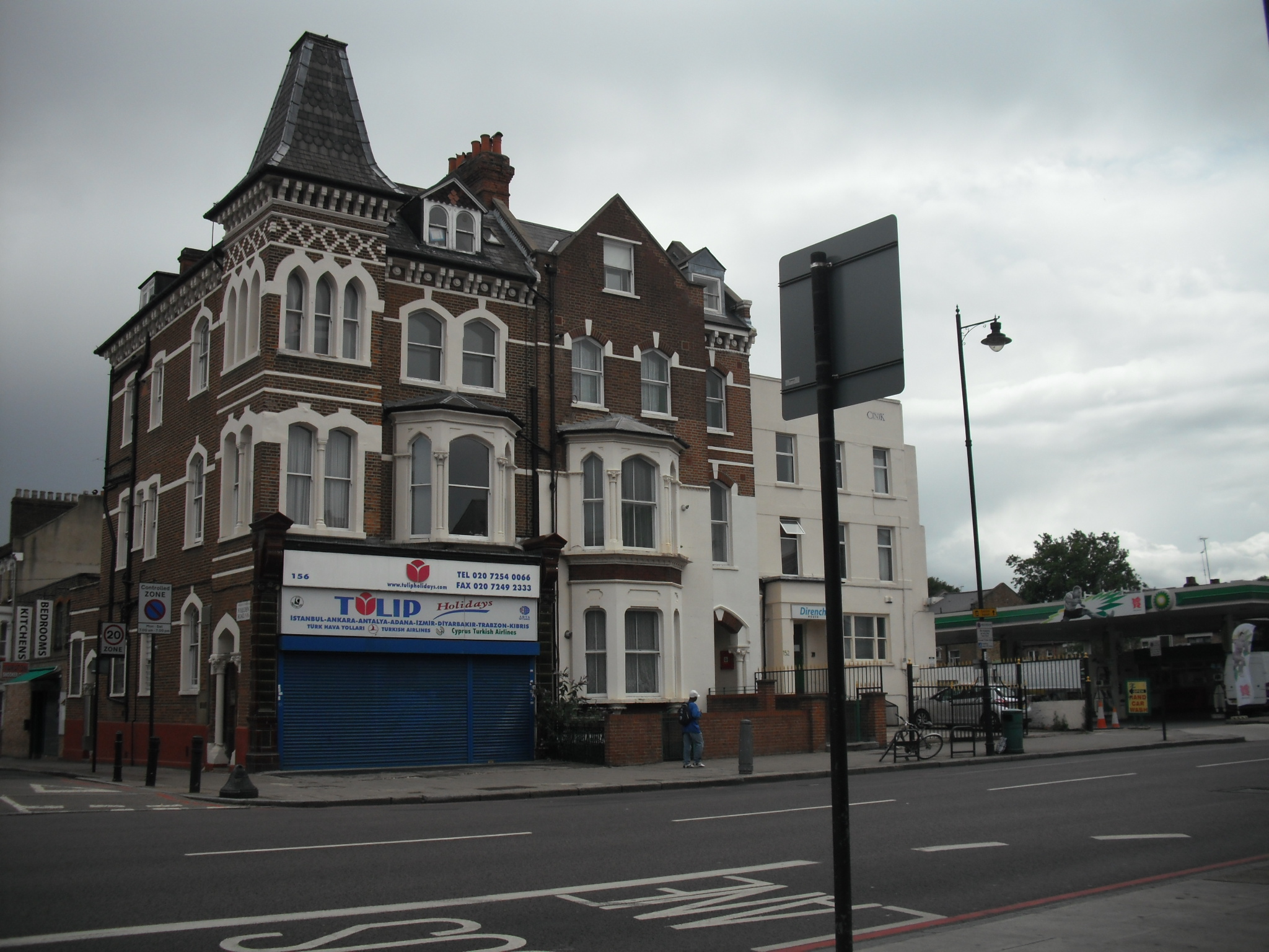 the building is next to the blue garage