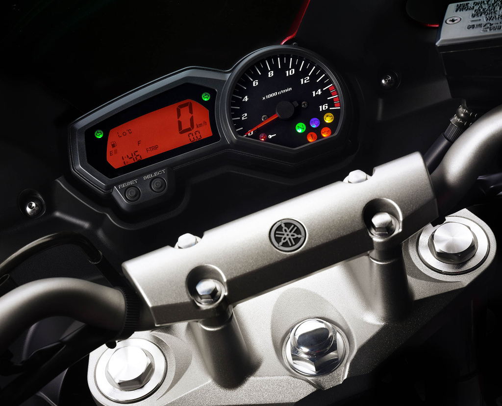 a close up of a motorcycle meter and the gauge