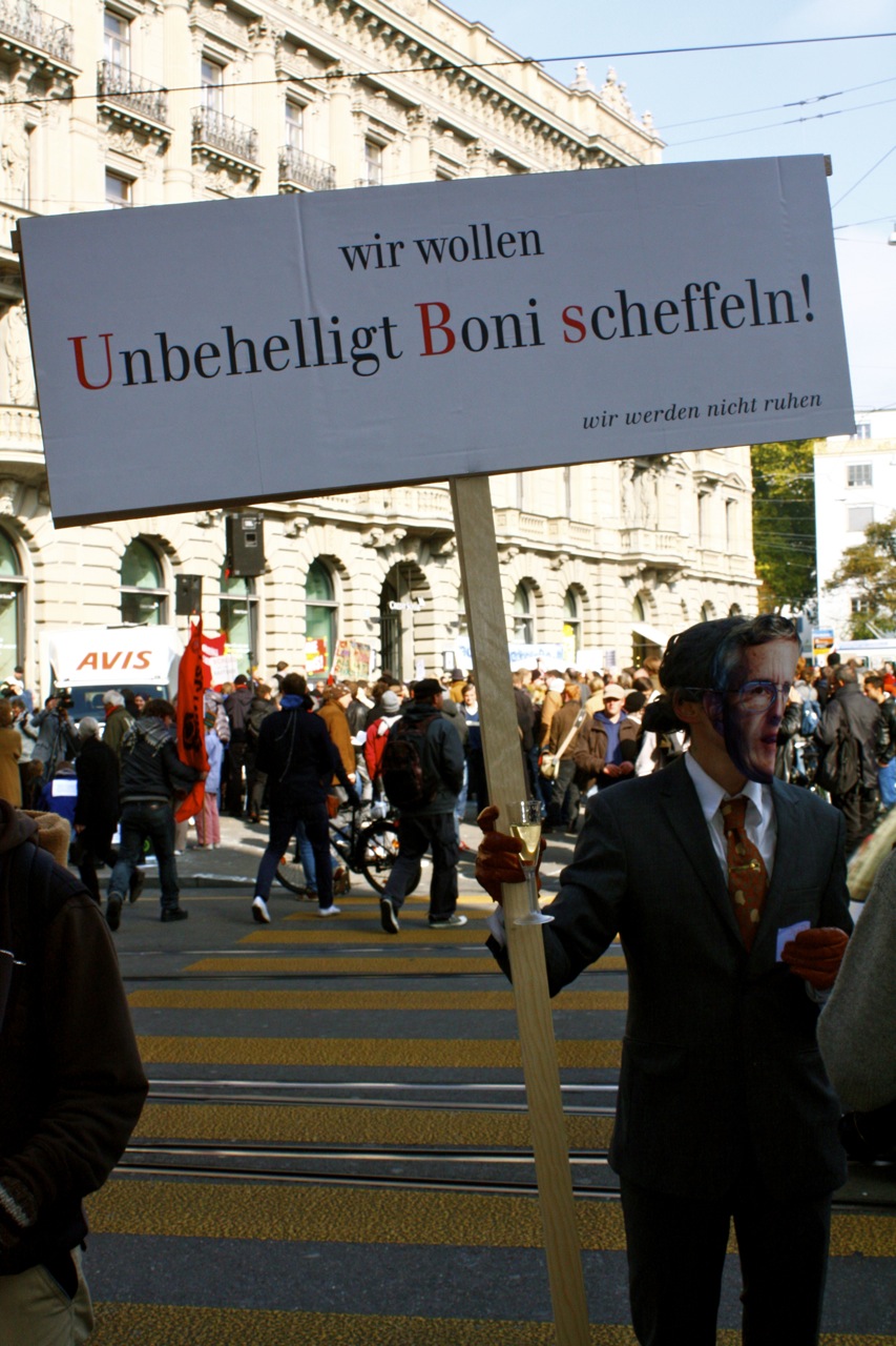 a man with a mask holding up a sign