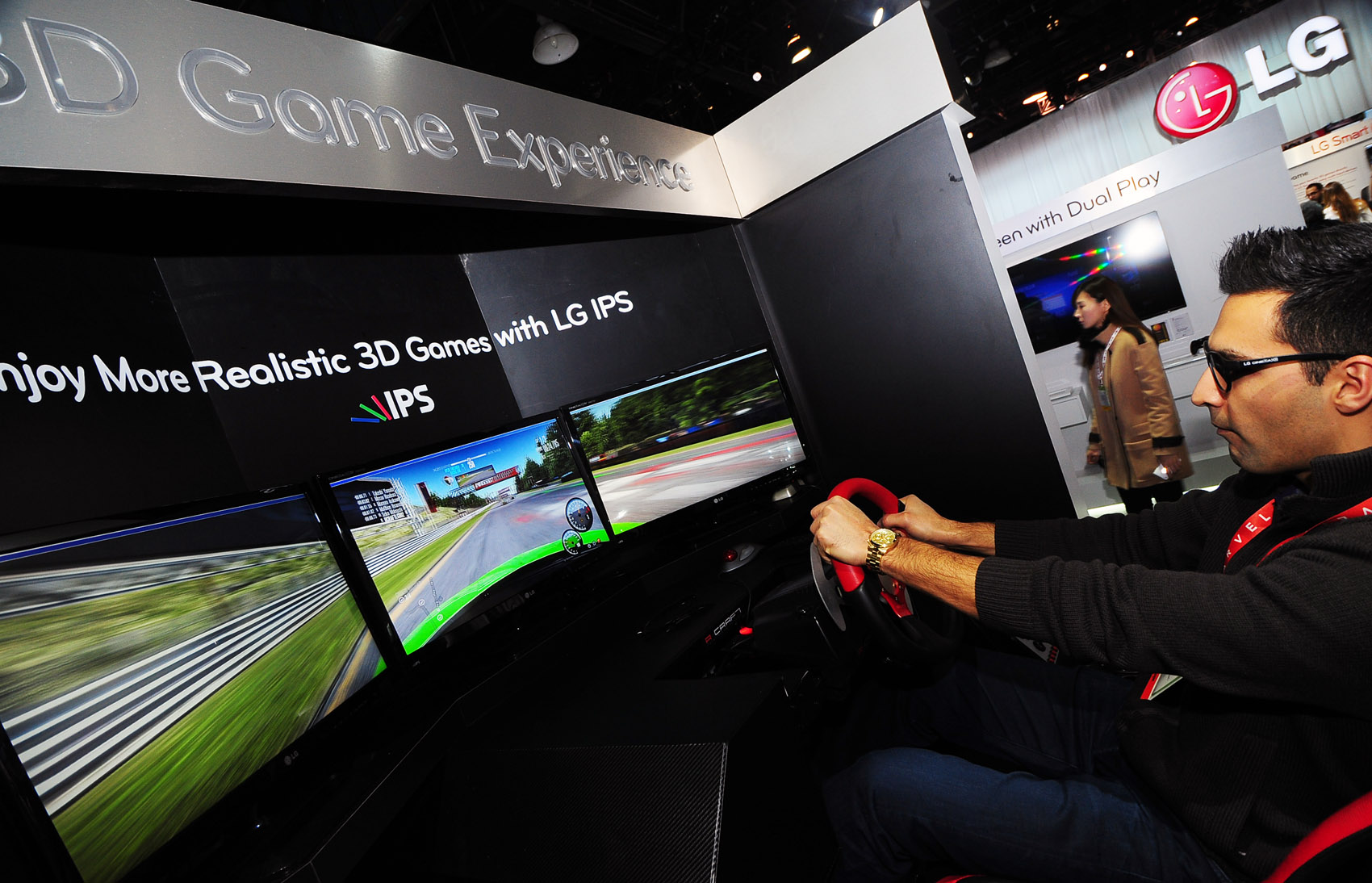 a man is playing a video game on an interactive display