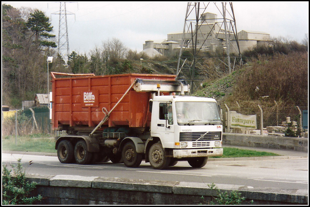 there is a dump truck on the street with no people in it