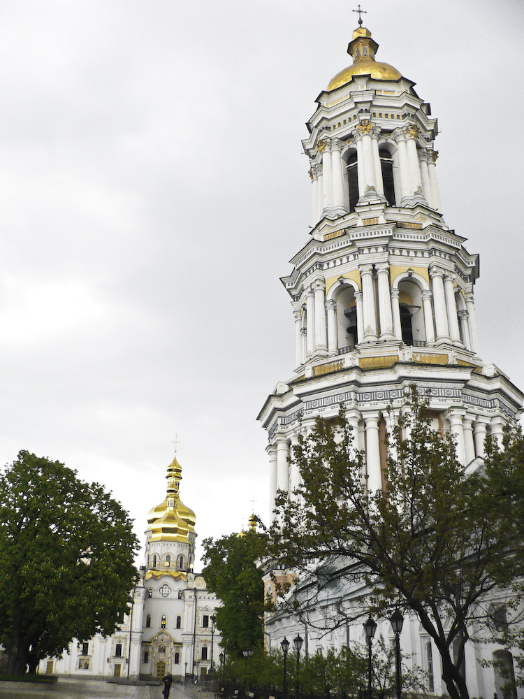 the very tall building has a gold - trimmed top