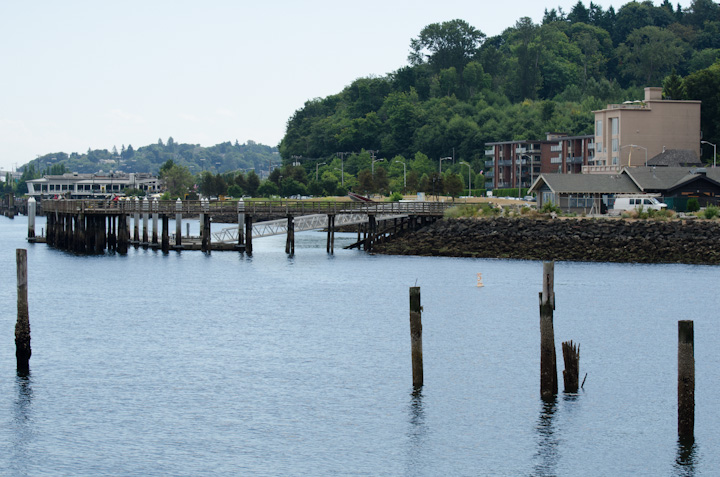 a body of water sitting next to small wooden buildings