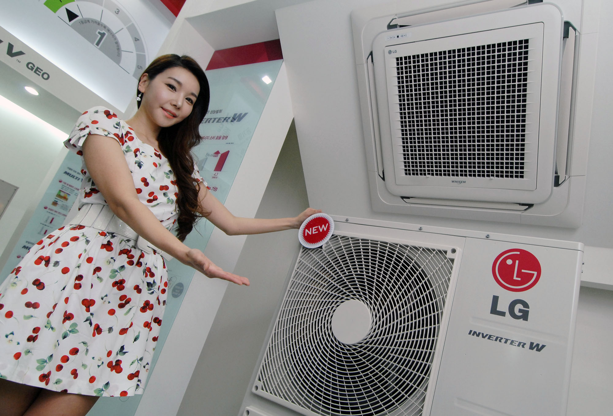 a girl is posing in front of a strange shaped air conditioner
