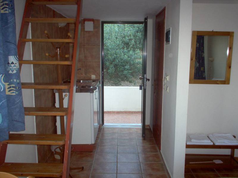 stairs in the hallway leading to a bathroom with an open door