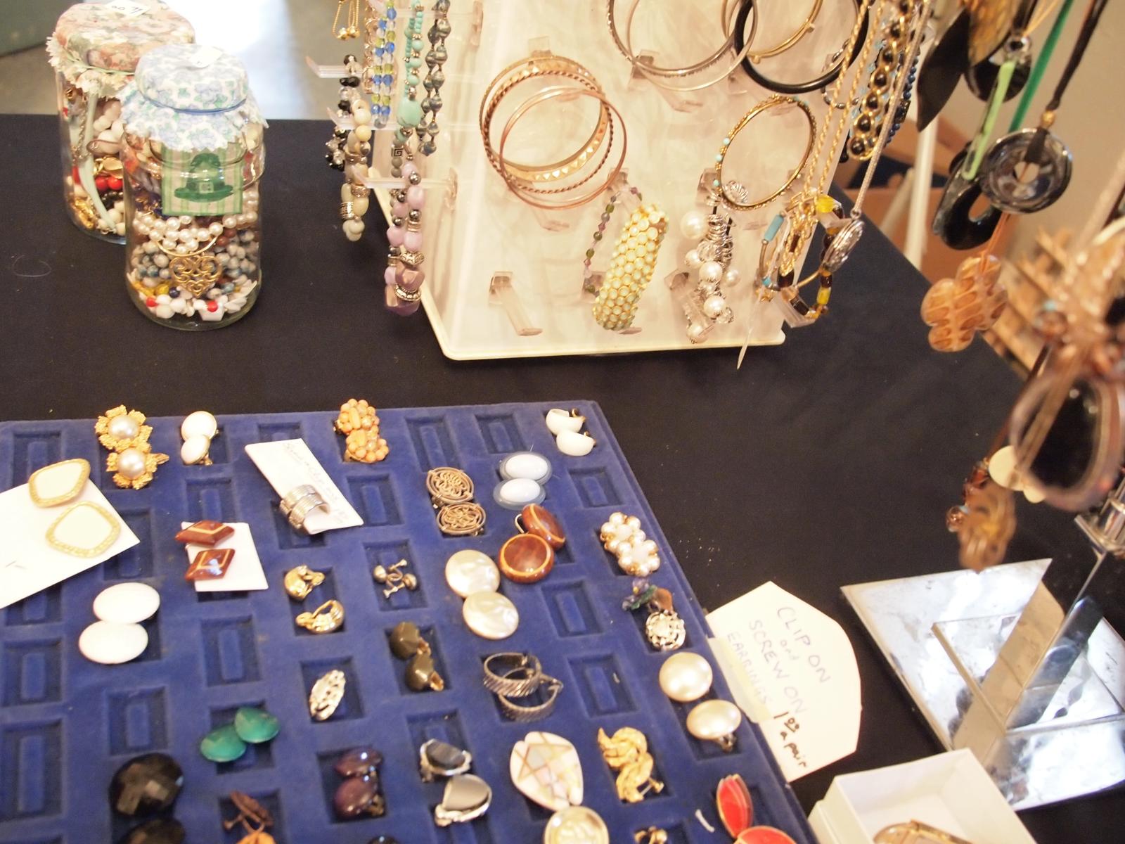 a table covered with jewelry and other items