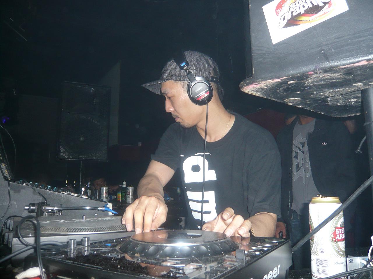 a man in a headphones at a dj set up
