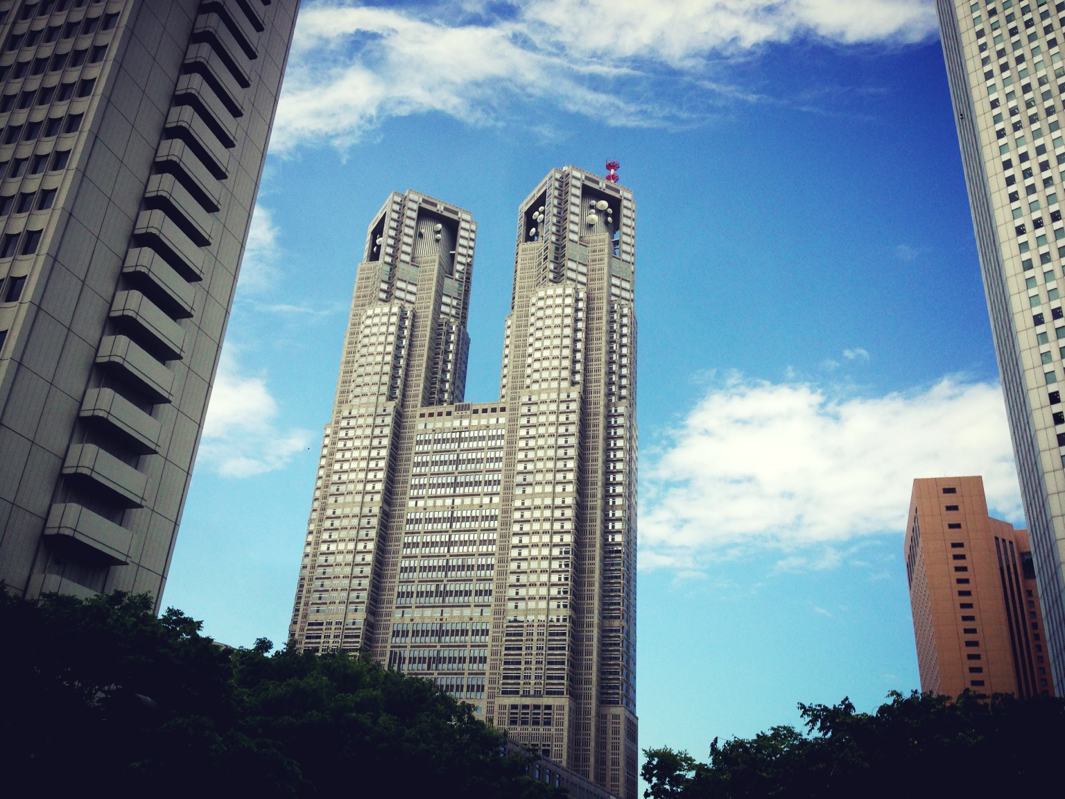 a group of tall building in the city