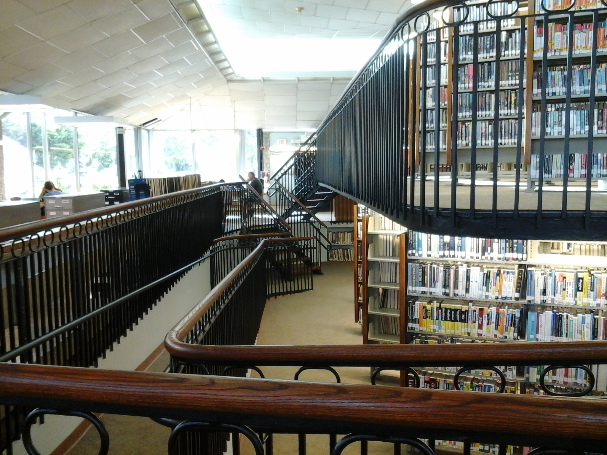 an empty liry with several books on the walls
