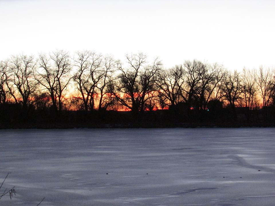 a beautiful sunset and an open field of ice
