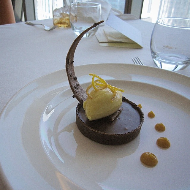 the chocolate dessert is topped with bananas and whipped cream