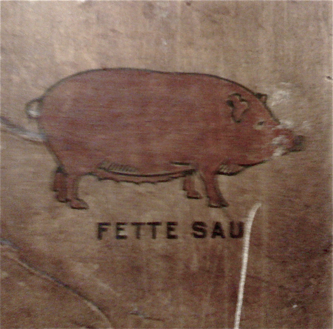 a pig that is on the side of a wall