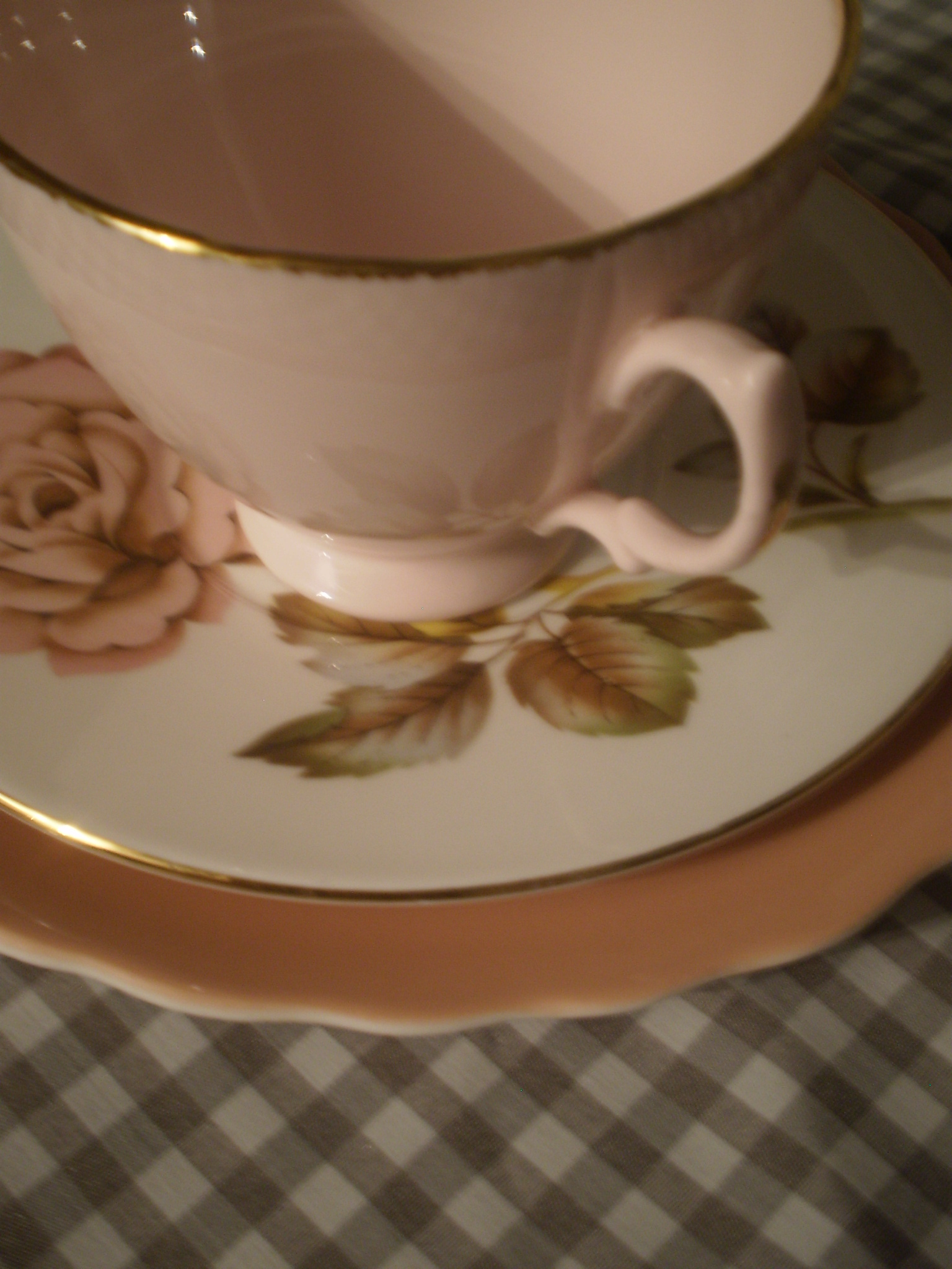 two tea cups with matching saucers and saucers are seen