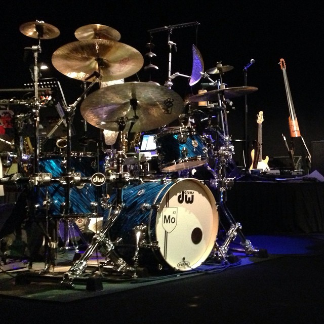 a drumming kit with some blue drums on the stage