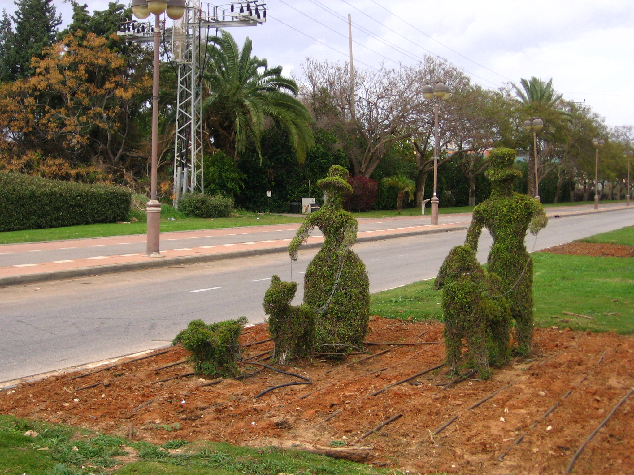 some cute looking garden art made to look like people