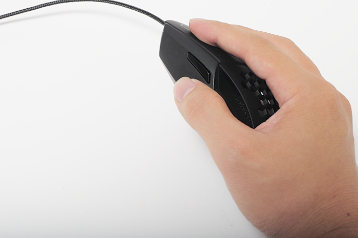 a hand holding a black computer mouse next to a computer mouse