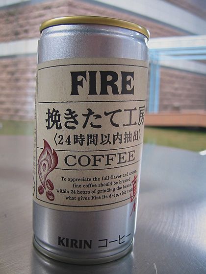 a can with coffee on a table outside