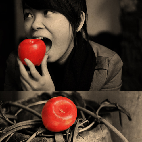 the woman eating an apple is posing for this picture