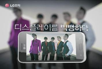 a phone screen with a picture of korean boys in suits