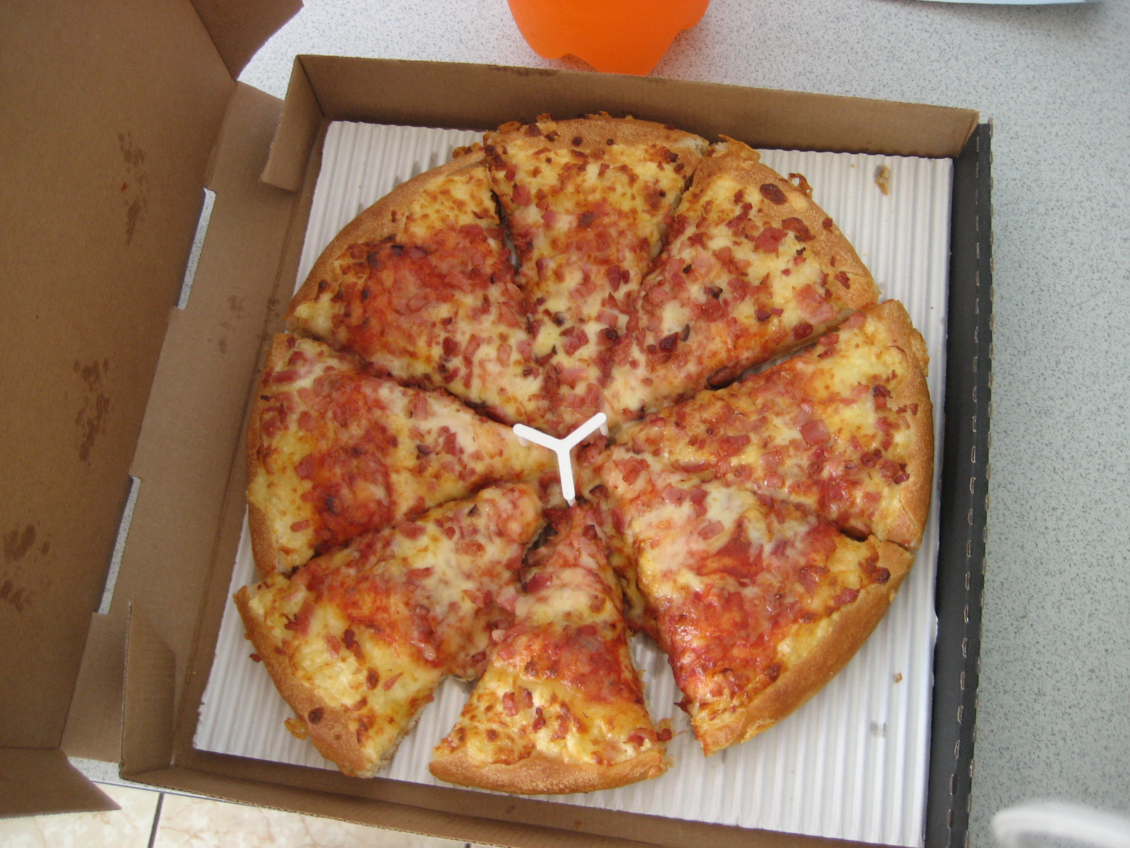 a box that has a large pizza in it