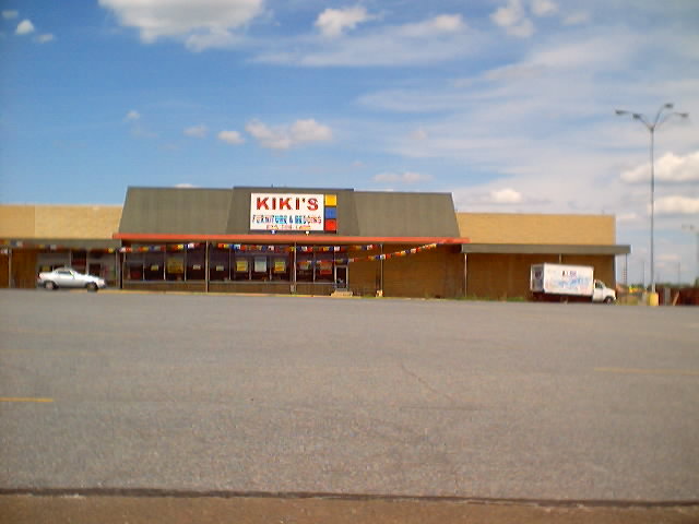 a store front is shown from across the street