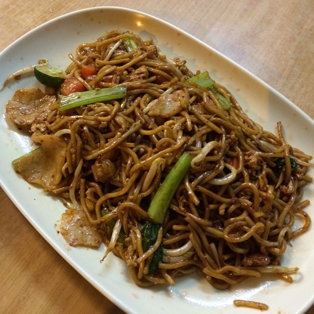 chinese noodles with vegetables are sitting on a plate