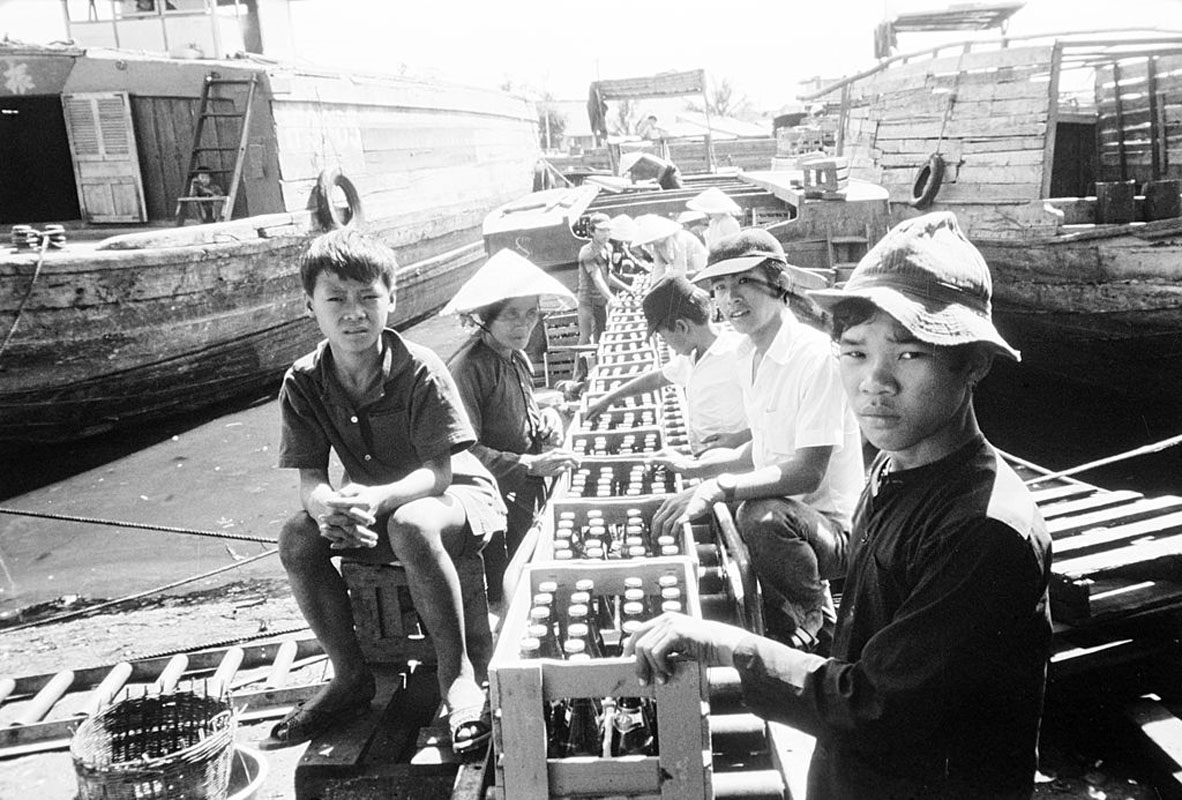 black and white po of men on a boat