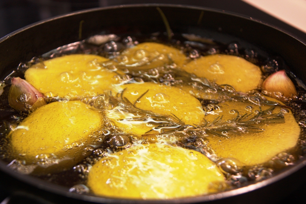 a large pan of food that is cooking on a stove