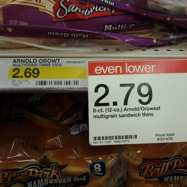 some bagels are next to a package of seven lowers