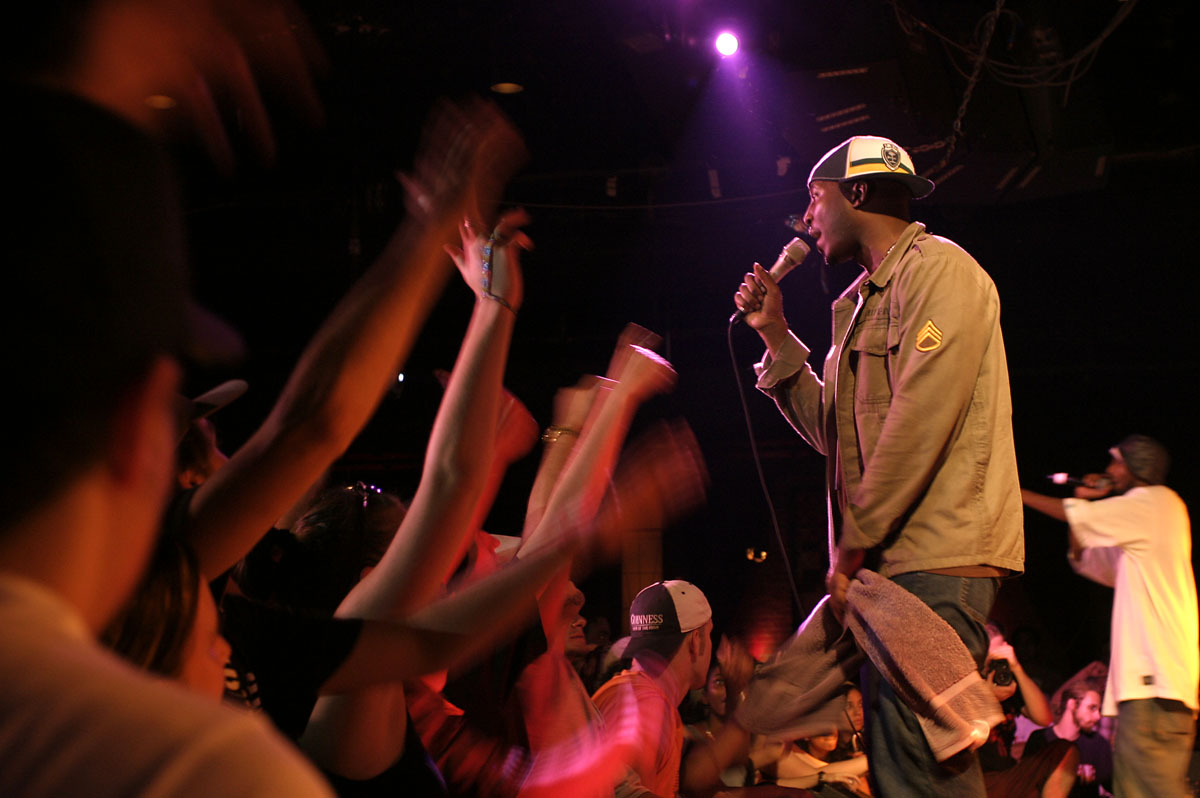 a man on stage singing into a microphone