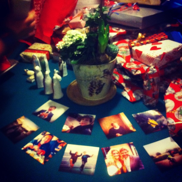 there are many christmas gifts and other holiday pictures on a table