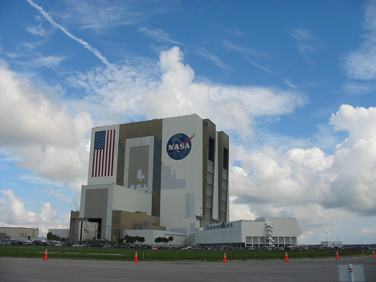 nasa headquarters building with flag flying high up in the sky