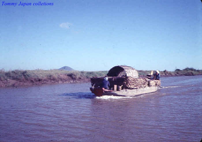 two people in a boat that is out in the water