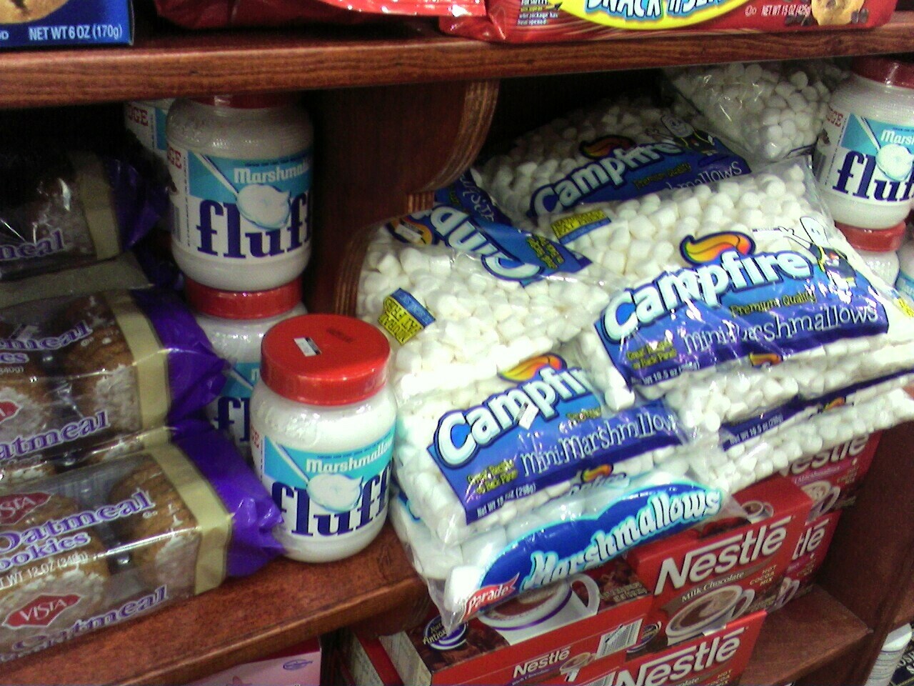 a store shelf containing food with many types of confections