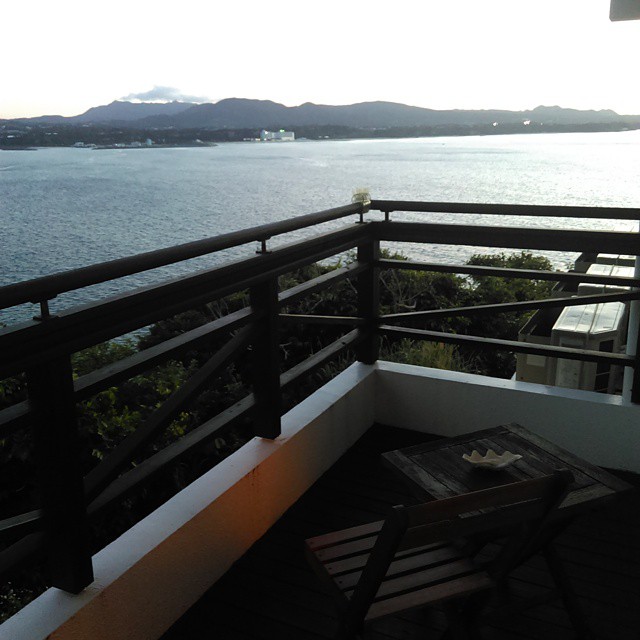 a balcony with a view of the water