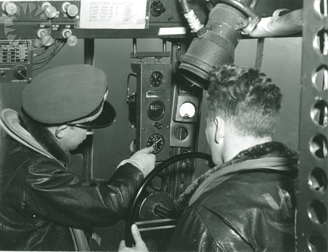 two pilots are operating machinery to operate