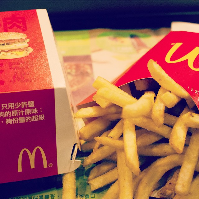 this mcdonald's lunch consists of french fries, burger and ketchup