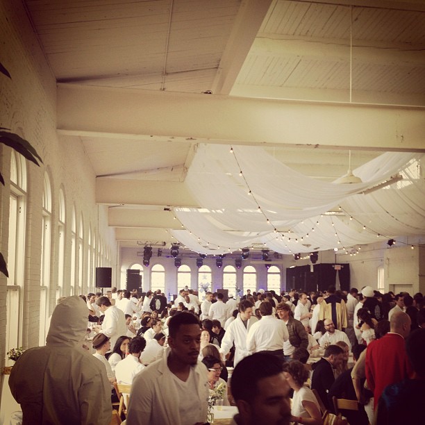 a crowded dining hall at a social gathering