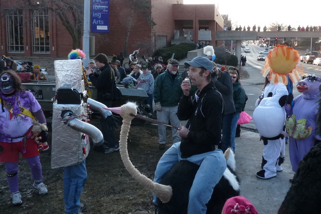 people dressed as sesame the dog, an ostrich, and others wearing costumes