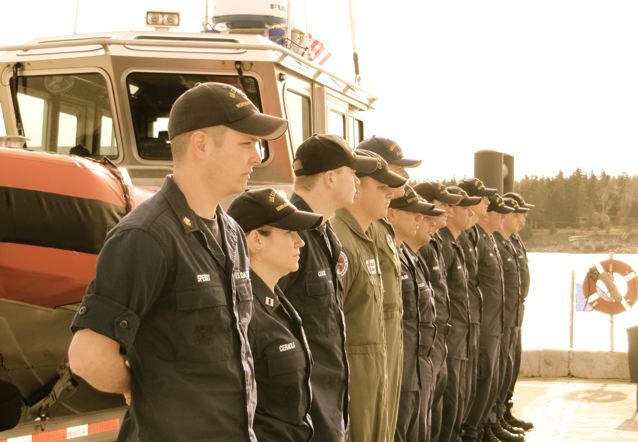 a row of uniformed officers standing next to each other
