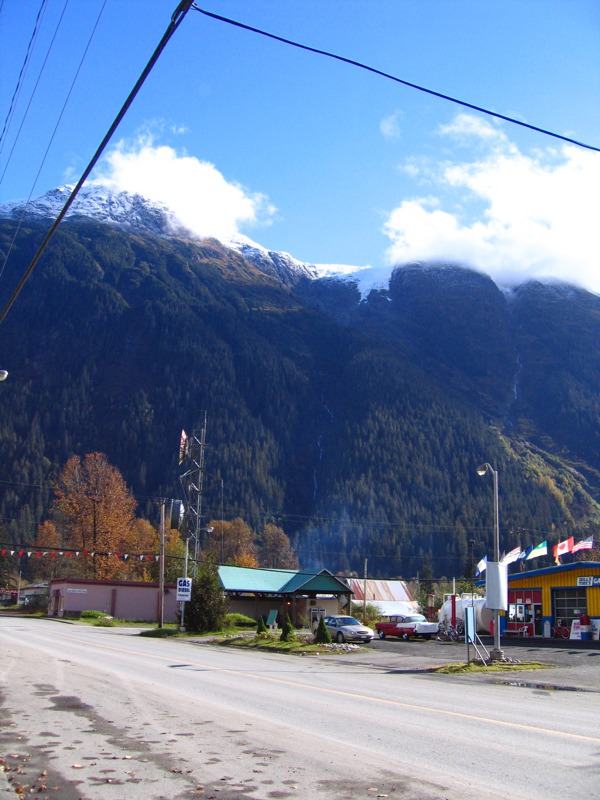 view of mountains and a city intersection with shops