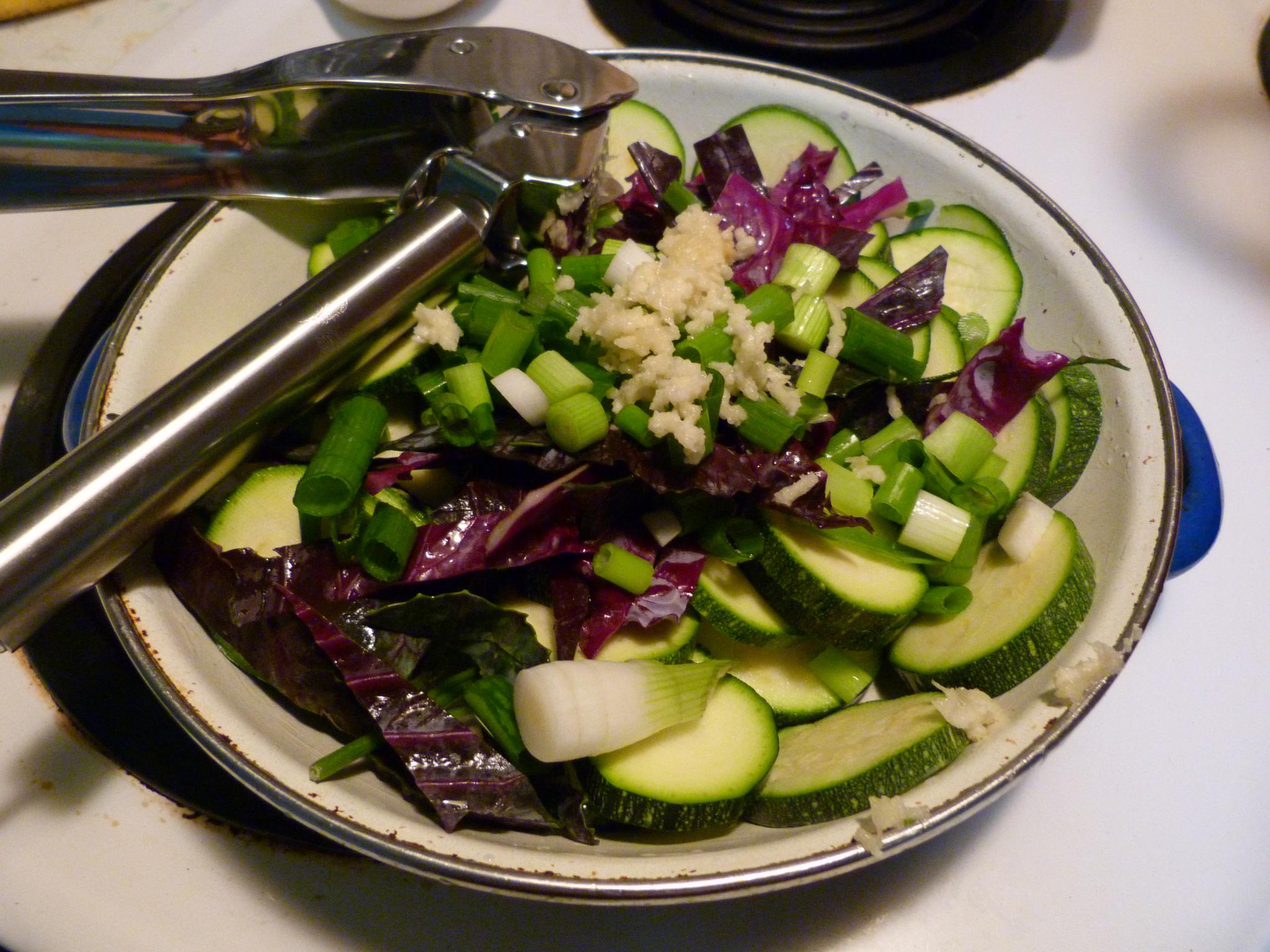 a dish of vegetables being put into the bowl