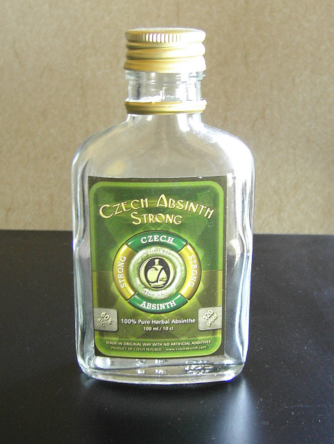 a small bottle that is sitting on the table
