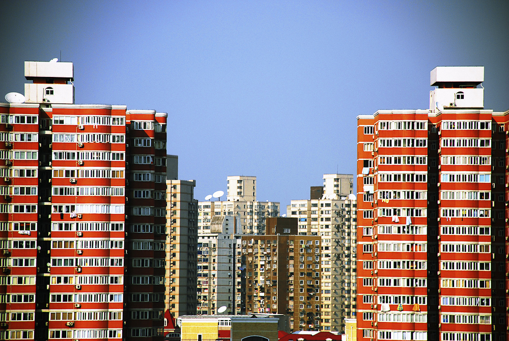 a city filled with tall red brick buildings