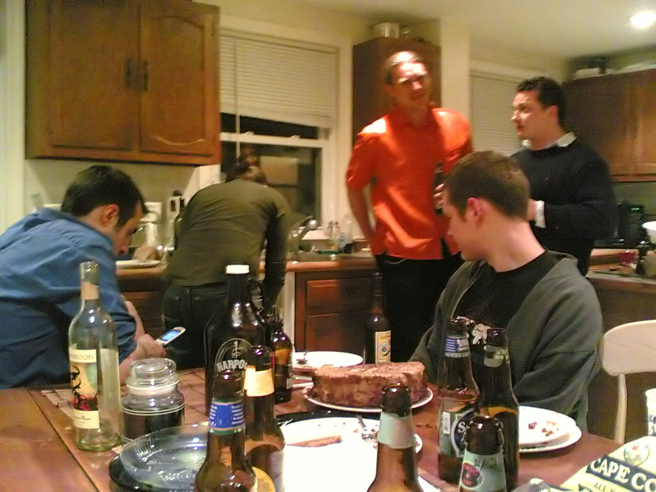 a group of men gathered around a dinner table