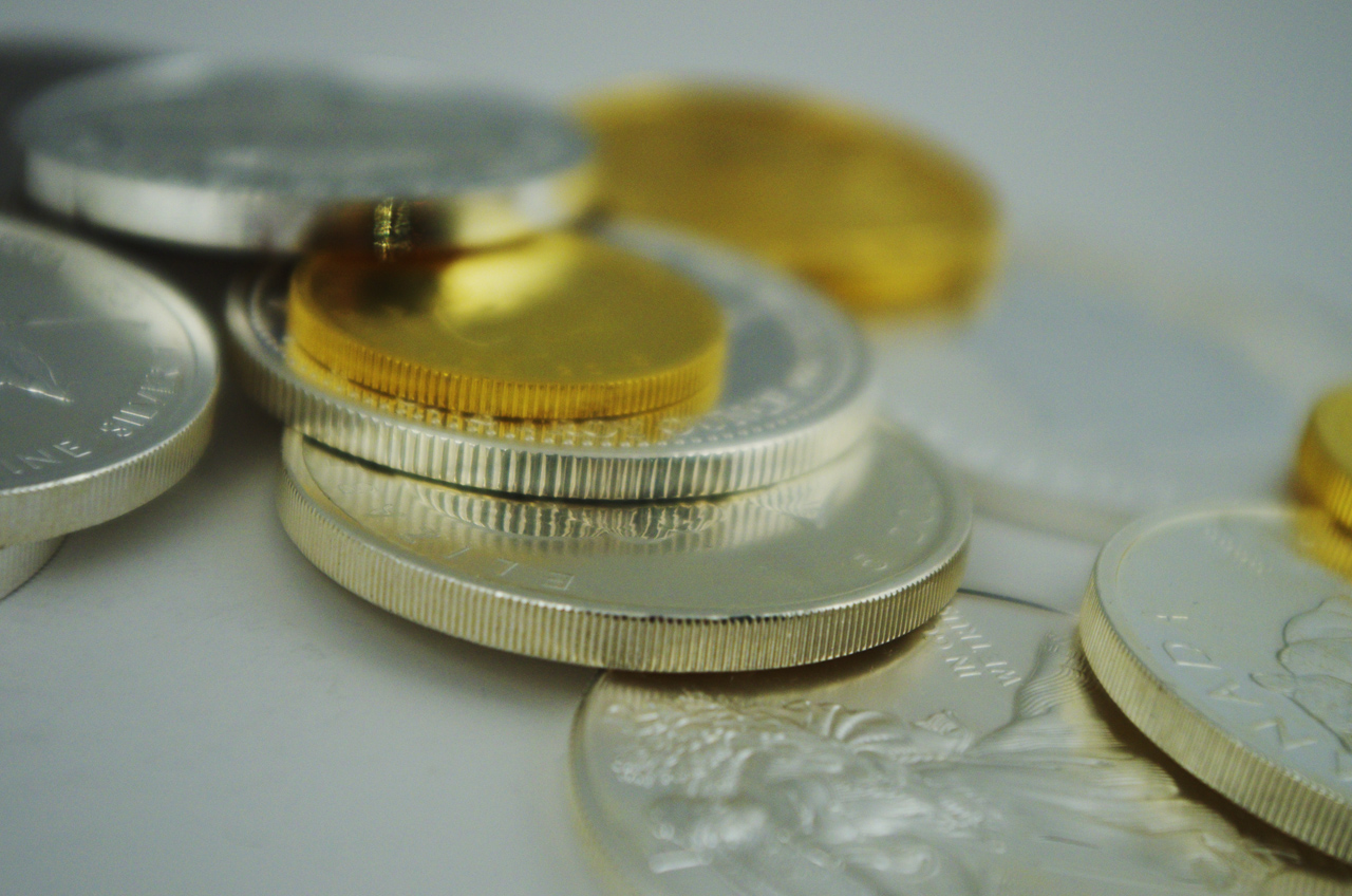 a group of money and coin are grouped together