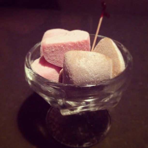 some pieces of marshmallows in a bowl of liquid